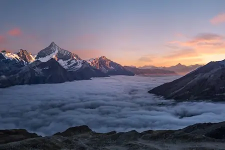 Sea of Clouds Dancing Below Alpine Peaks